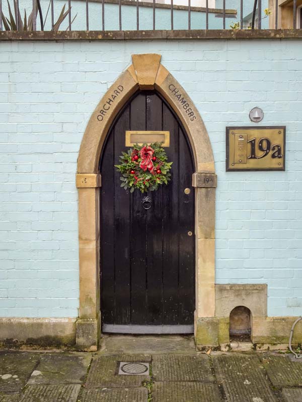 Arched garden door with a boot scraper, Bristol, December 2019