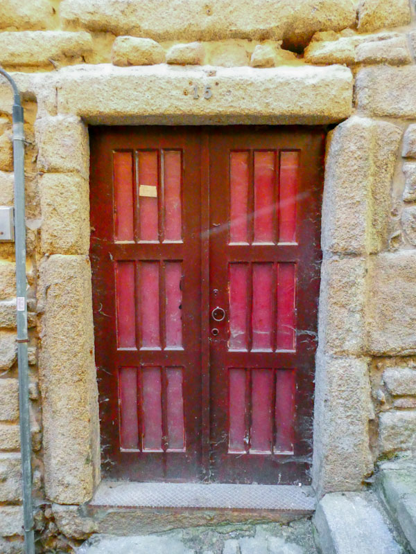 Red panelled door, Porto, Portugal, June 2022
