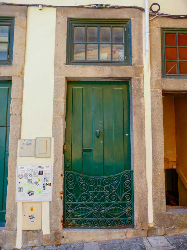 Green door with beautiful 1852 gate, Porto, Portugal, June 2022